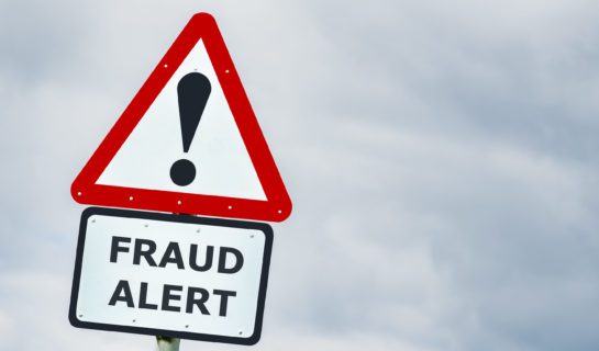 A triangular warning sign saying 'Fraud Alert!'