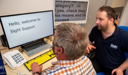 Sight Loss Advisor conducting training with client on computer