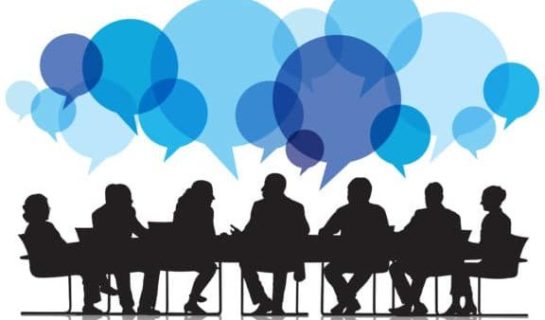 outline of people at a meeting with blue speech bubbles above