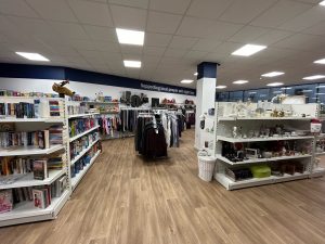 The interior of our shop, we have white shelving and light wood floors. The room is very spacious. A variety of homeware and accessories are on display.