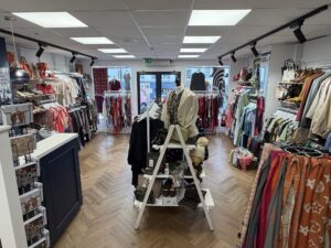 A view across the new Marlborough shop, showing its spacious layout, clear walkways and displays of clothing and accessories.